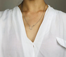 Load image into Gallery viewer, Silver Aquarius Sign Necklace worn on a model  
