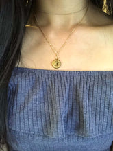 Load image into Gallery viewer, Gold Aquarius Disc Necklace, layering with a dainty gold colored choker worn on a model 
