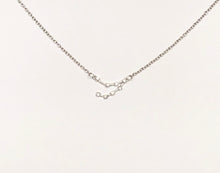 Load image into Gallery viewer, A Silver Capricorn Zodiac Constellation Necklace on a white background.
