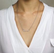 Load image into Gallery viewer, Front side of the Silver Cancer Necklace worn on a model
