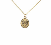 Load image into Gallery viewer, The front of a gold Gemini Medallion Necklace on a white background.
