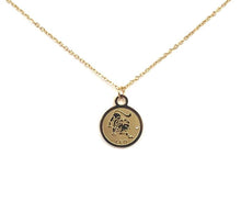 Load image into Gallery viewer, The front side of a gold Leo Medallion Necklace on a white background.
