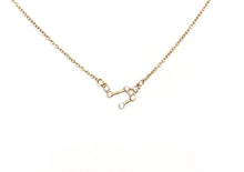 Load image into Gallery viewer, A gold Libra Zodiac Constellation Necklace on a white background.
