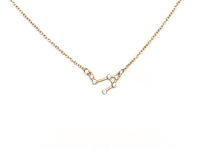 A gold Libra Zodiac Constellation Necklace on a white background.