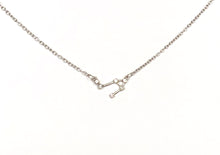 Load image into Gallery viewer, A silver Libra Zodiac Constellation Necklace on a white background. 
