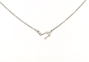 A silver Libra Zodiac Constellation Necklace on a white background. 