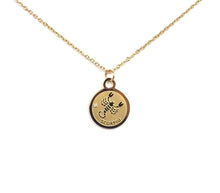 Load image into Gallery viewer, The Front side of a gold Scorpio Medallion Necklace is on a white background. 
