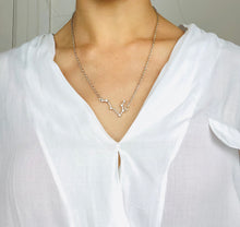 Load image into Gallery viewer, Silver Gemini Constellation Necklace, worn on a model 
