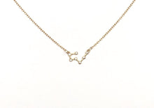 Load image into Gallery viewer, A gold Taurus Zodiac Constellation Necklace is on a white background.
