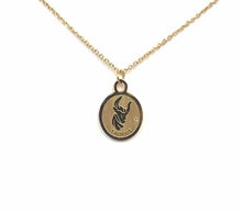 Load image into Gallery viewer, The front side of a gold Taurus Medallion Necklace is on a white background. 
