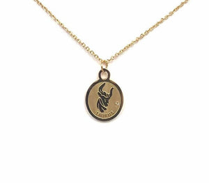 The front side of a gold Taurus Medallion Necklace is on a white background. 