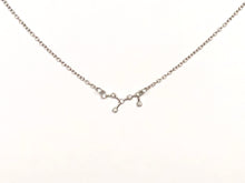 Load image into Gallery viewer, A silver Virgo Zodiac Constellation Necklace on a white background.
