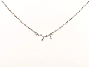 A silver Virgo Zodiac Constellation Necklace on a white background.