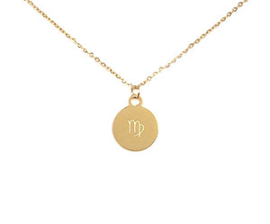 The back side of a gold Virgo Zodiac Coin Necklace on a white background. 