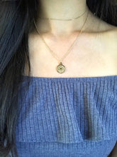 Load image into Gallery viewer, Front side of a gold Cancer Disc Necklace worn on a model
