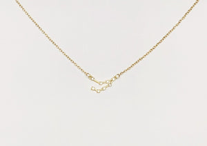 A gold Capricorn Zodiac Constellation Necklace on a white background.