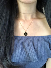 Load image into Gallery viewer, The Libra Sign Symbol, which is on the back side of the Libra Zodiac Sign Necklace is worn on a model.
