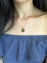 Load image into Gallery viewer, The back side of a Virgo zodiac sign Necklace that features a letter M-like symbol, paired with a gold dainty choker is worn on a model. 
